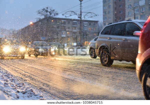 cars in smoke of\
traffic jam of winter\
storm