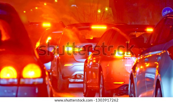 Cars stop in queue\
due to a car crash, blur