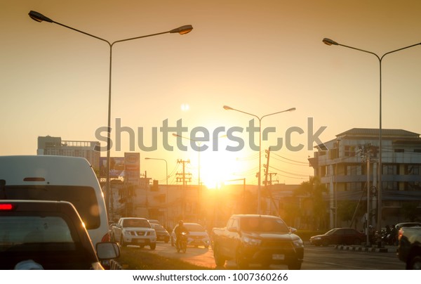 Cars stuck in\
traffic jam at an intersection when sunset time in  town,Chiangmai\
Thailand on 22 January\
2018
