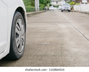 Car's Tire On Concrete Road With Proper Tire Pressure Being Ready For A Safe Driving Off