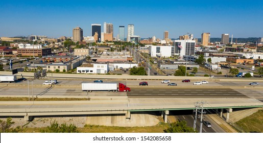 Cars and trucks traverse the urban jungle and maze of highway around downtown Birmingham Alabama