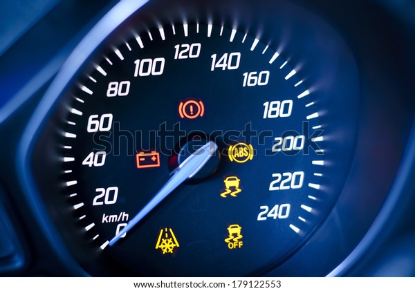 Car\'s, vehicle\'s speedometer with visible\
information display - ignition warning lamp  and brake system\
warning lamp, visible symbols of instrument cluster, with warning\
lamps illuminated.