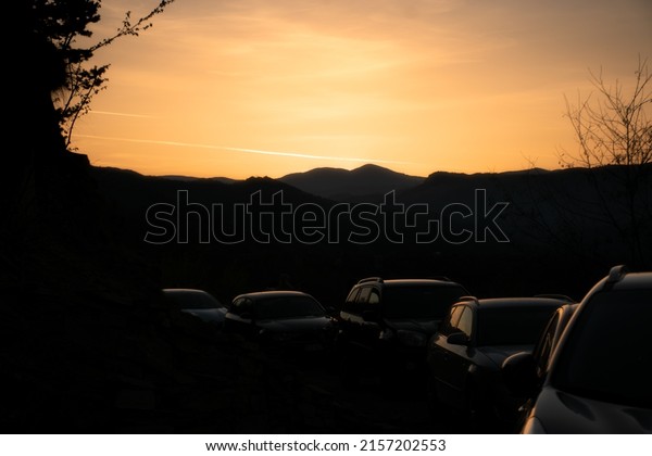 cars waiting to\
go off after the sunset\
ends