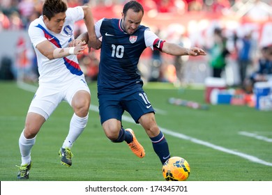 CARSON, CA. - FEB 01: Korea D Yong Lee #14 & USA M Landon Donovan #10 During The U.S. Mens National Team Soccer Friendly Against Korea Republic On Feb 1st 2014 At The StubHub Center In Carson, Ca.