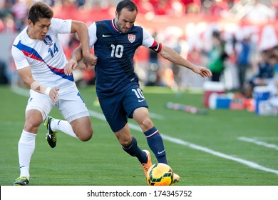 CARSON, CA. - FEB 01: Korea D Yong Lee #14 & USA M Landon Donovan #10 During The U.S. Mens National Team Soccer Friendly Against Korea Republic On Feb 1st 2014 At The StubHub Center In Carson, Ca.