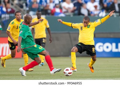 CARSON, CA. - JUNE 6: Grenada D Leon Johnson #14 (L) & Jamaica D Eric Vernan #8 (R) During The 2011 CONCACAF Gold Cup Group B Game On June 6, 2011 At The Home Depot Center In Carson, CA.