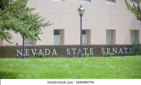 Carson City, NV, USA 10/9/2020 — Nevada State Senate Written On The Exterior Of The State Legislature Building. Located Next To The Capitol On N Carson St. Green Lawn In Bokeh.