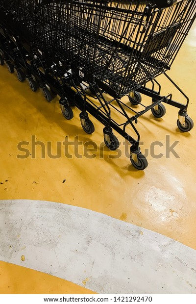 The cart is\
lined up on a yellow\
background.