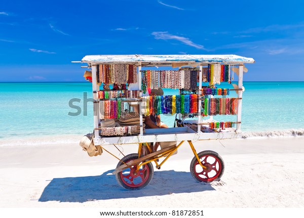 Cart selling typical souvenirs on the beautiful\
cuban beach of Varadero