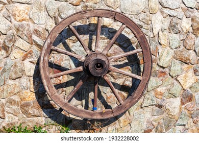 Cart Wagon Wheel . Wooden Cartwheel like a decor on the wall . Burnt wood finish . Good for ornamental use as rustic feature