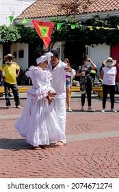 Cartagena, Bolivar, Colombia; 11- 11- 2021: Couple dance the Cumbia traditional, folk dance which has the contribution of three races: indigenous, black and white. 