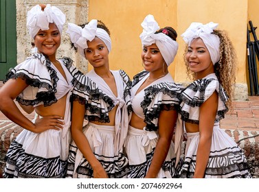 Cartagena, Bolivar, Colombia; 11- 11- 2021: Four Young Women Pose For A Photo Before Going Out To Dance In The Square.