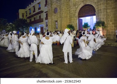 Cartagena, Colombia - February 22, 2014 - Dancers Wearing Traditional Garb Greet The Wedding Party Outside The Church Of San Pedro Claver. Cartagena, Colombia.