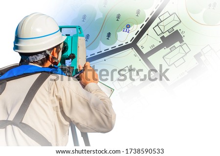 Cartography. Engineer-surveyor with equipment. A man makes maps. The cartographer works with a theodolite or total positioning station. A man in a white helmet on the background of the map.