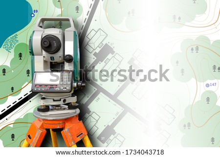 Cartography. Theodolite on the background of a topographic map. Geodesic and cartographic equipment. Study of the area. Mapping. Work of the cartographer. Topography and cartography.