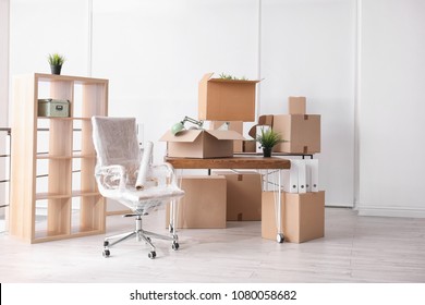 Carton Boxes With Stuff In Room. Office Move Concept