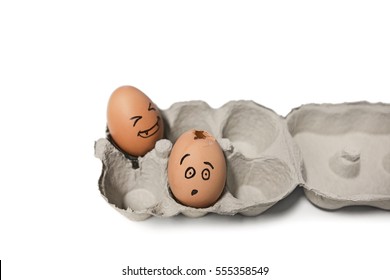Carton Of Brown Eggs With One Cracked Egg