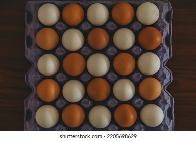 Carton Of Eggs Of Mixed Colors In Perfect Harmony