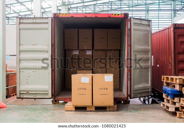 The cartons with\
loading out of container