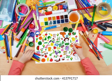 cartoon food collection, fruit and vegetables child drawing, top view hands with pencil painting picture on paper, artwork workplace - Powered by Shutterstock