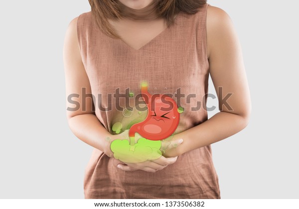 Cartoon stomach in the woman belly filled with\
gas the cause of flatulence and stomach ache, inflammatory bowel\
disease, Irritable Bowel\
Syndrome