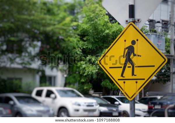 \
Cartoon traffic sign for crossing the\
road on yellow plate, Symbols for crossing the\
road