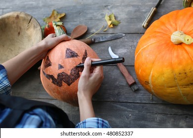 carve pumpkins for Halloween