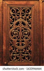 Carved Cross At Confessional Booth In Catholic Church