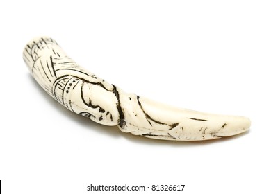 Carved ivory tusk isolated on white