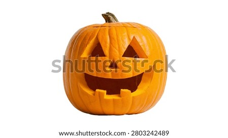 Carved orange jack-o-lantern pumpkin with triangular eyes and wide toothy grin