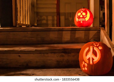 Carved Pumpkins At Night Waiting For Halloween Trick Or Treaters