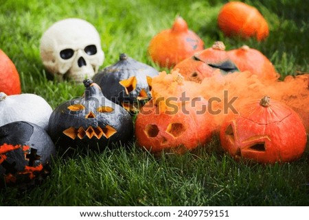carved pumpkins orange smoke blurred