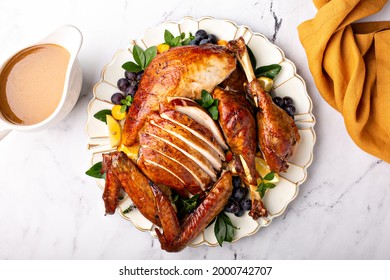 Carved Roasted Turkey For The Celebration Thanksgiving Or Christmas Dinner On A Plate Overhead Shot