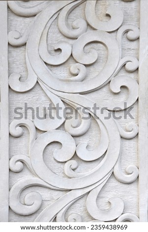 CARVED SANDSTONE SWIRLING FLOURISHES FEATURED WALL PANEL - A beautiful crisp decorative intricate flowing curved wavy swirl design handcrafted in a light natural stone color, edged with straight lines