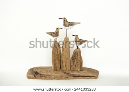 carved wood with metal elements and birds