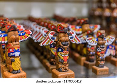 Carved Wooden Miniature First Nations Or Native American Indian Totem Pole Souvenirs At A Tourist Shop In Vancouver Canada