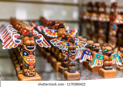 Carved Wooden Miniature First Nations Or Native American Indian Totem Pole Souvenirs At A Tourist Shop In Vancouver Canada