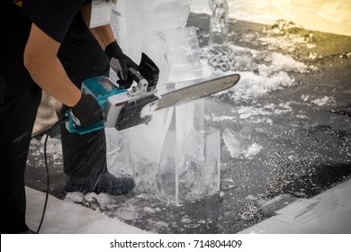 A Carver Using Tool For Carving Of His Ice Sculpture