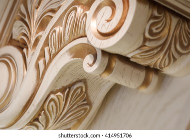  Carving Element. Furniture In Classic Style. White Color Wood With Gold Trim. Patina. Carving. Small Depth Of Field. Luxury Furniture. Use As Background.