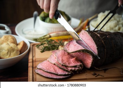 Carving Roast Beef With Knife And Fork