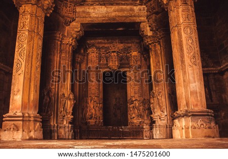 Carvings and reliefs inside sacred Hindu temple in Khajuraho, India. Artworks, columns and altar in the 10th century indian temple.