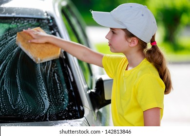 Carwash - young girl helping in carwash - Powered by Shutterstock