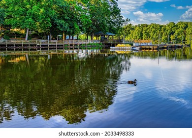 Cary, North Carolina USA-08 30 2021: Bond Park Lake And Boat Dock On A Summer Morning