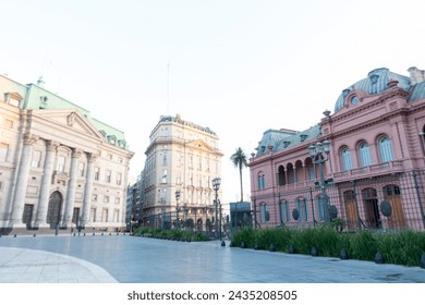 Casa Rosada;, and Banco Nación ,  Buenos Aires; Argentina; Government house; pink; sky; windown; arch; entrance; monument building; landmark; palm tree; green; square
