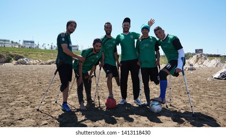 Casablanca, Morocco - APRIL 14 2019:  The Beach Of Casablanca. Men Playing Football At The Beach. Morocco Paralympic Football Team
