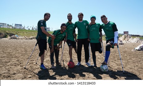 Casablanca, Morocco - APRIL 14 2019:  The Beach Of Casablanca. Men Playing Football At The Beach. Morocco Paralympic Football Team
