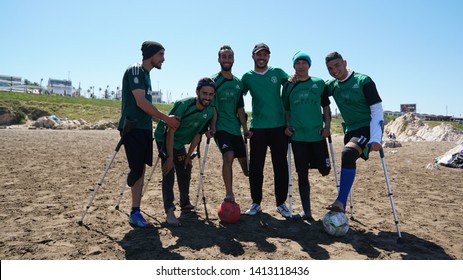 Casablanca, Morocco - APRIL 14 2019:  The Beach Of Casablanca. Men Playing Football At The Beach. Morocco Paralympic Football Team
