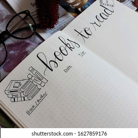 Casablanca, Morocco,  January 10, 2020 : Books to read text written on notebook or bullet journal 