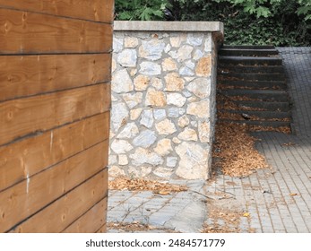 Cascade Layers: Wooden Brown Planks, Stone Wall, and Concrete Staircase in an Alley Street Shortcut. - Powered by Shutterstock