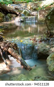 cascade of mountain stream in forest